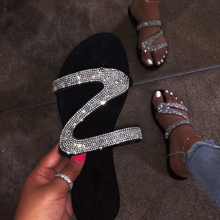 Jeweled sandal.