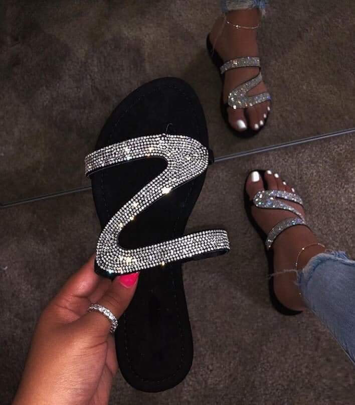 Jeweled sandal.